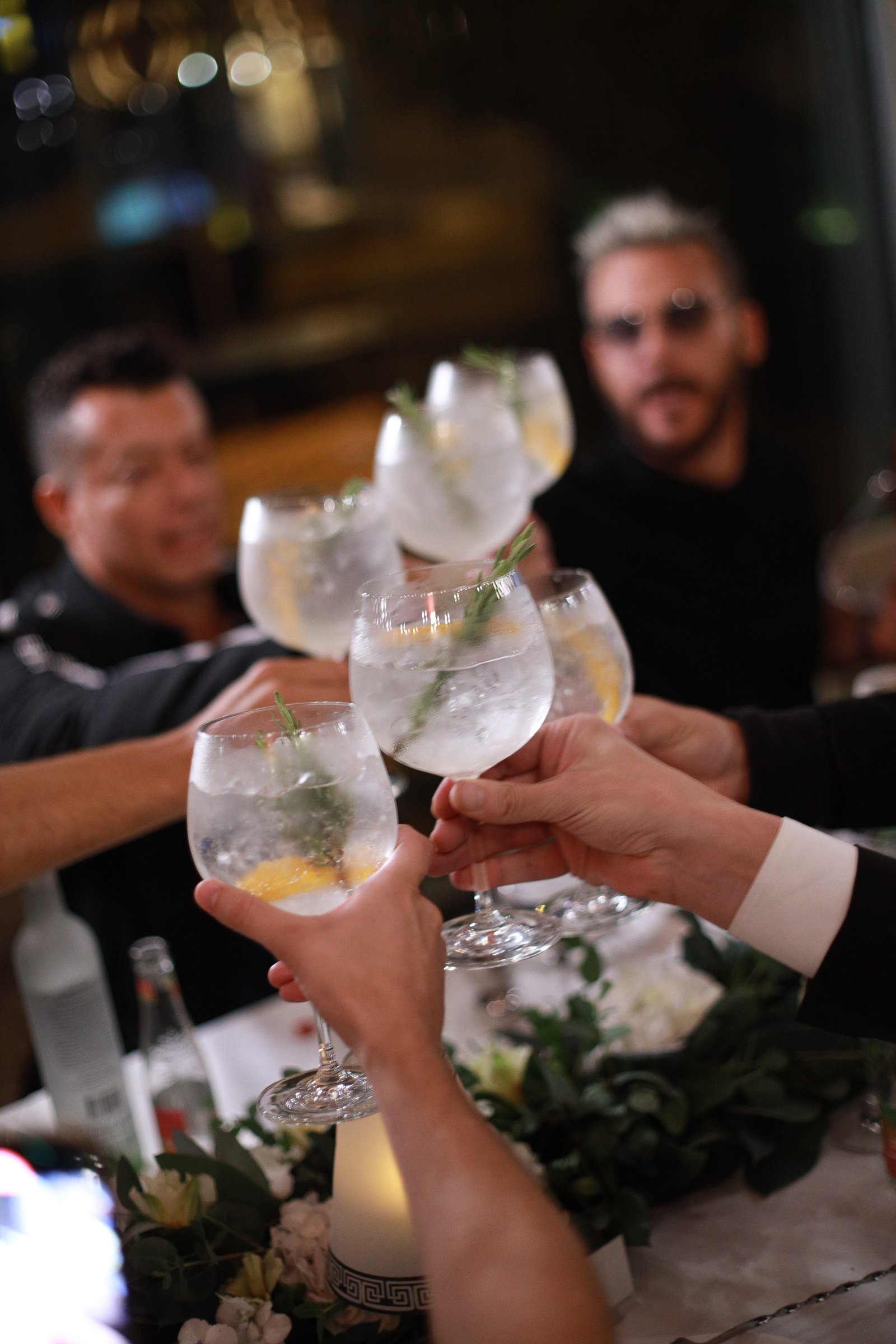 Bartender pouring a measured cocktail at the Conclave bar